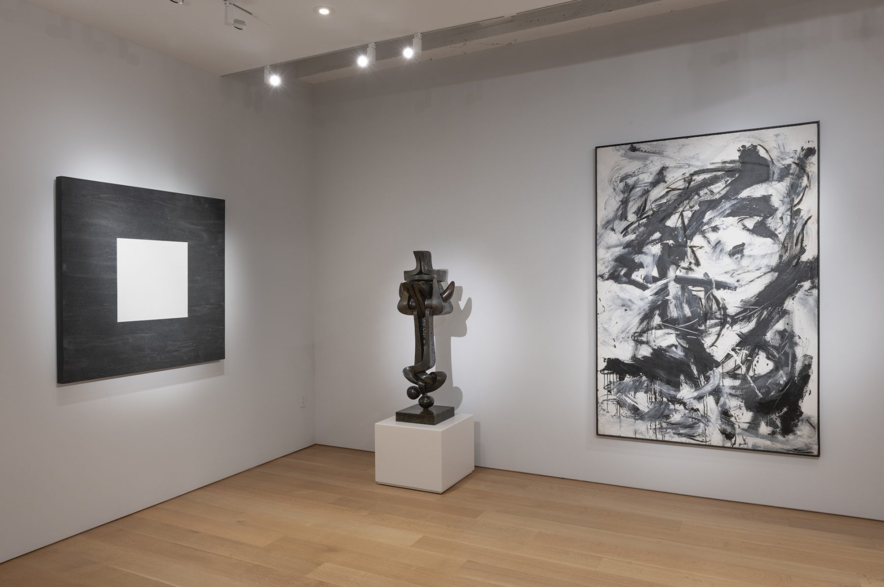 Gallery view of three different black and white pieces.